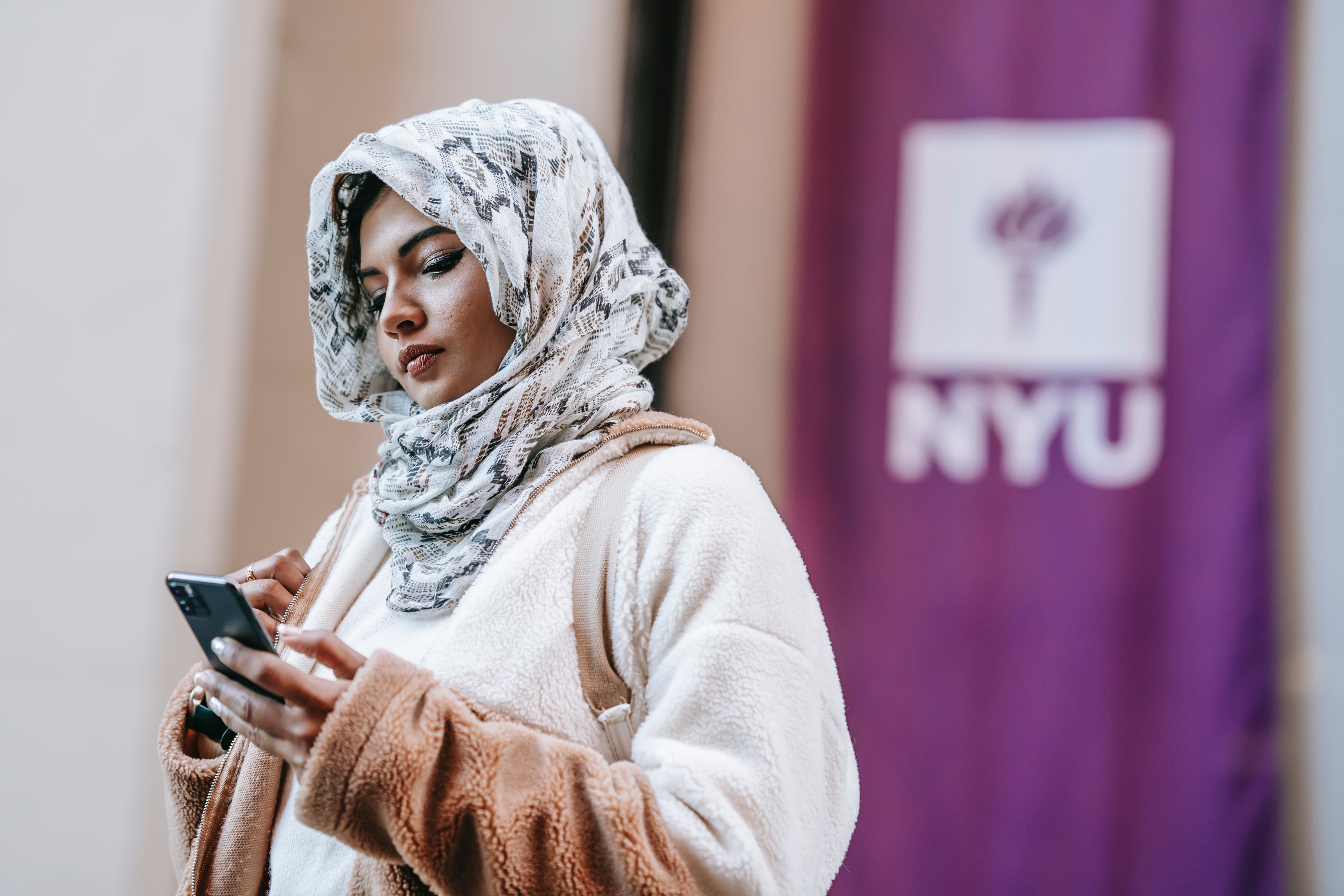 Image of student checking cell phone