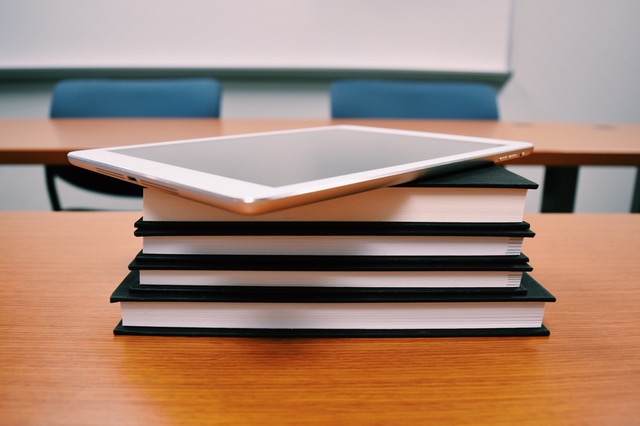 books and tablet on a table