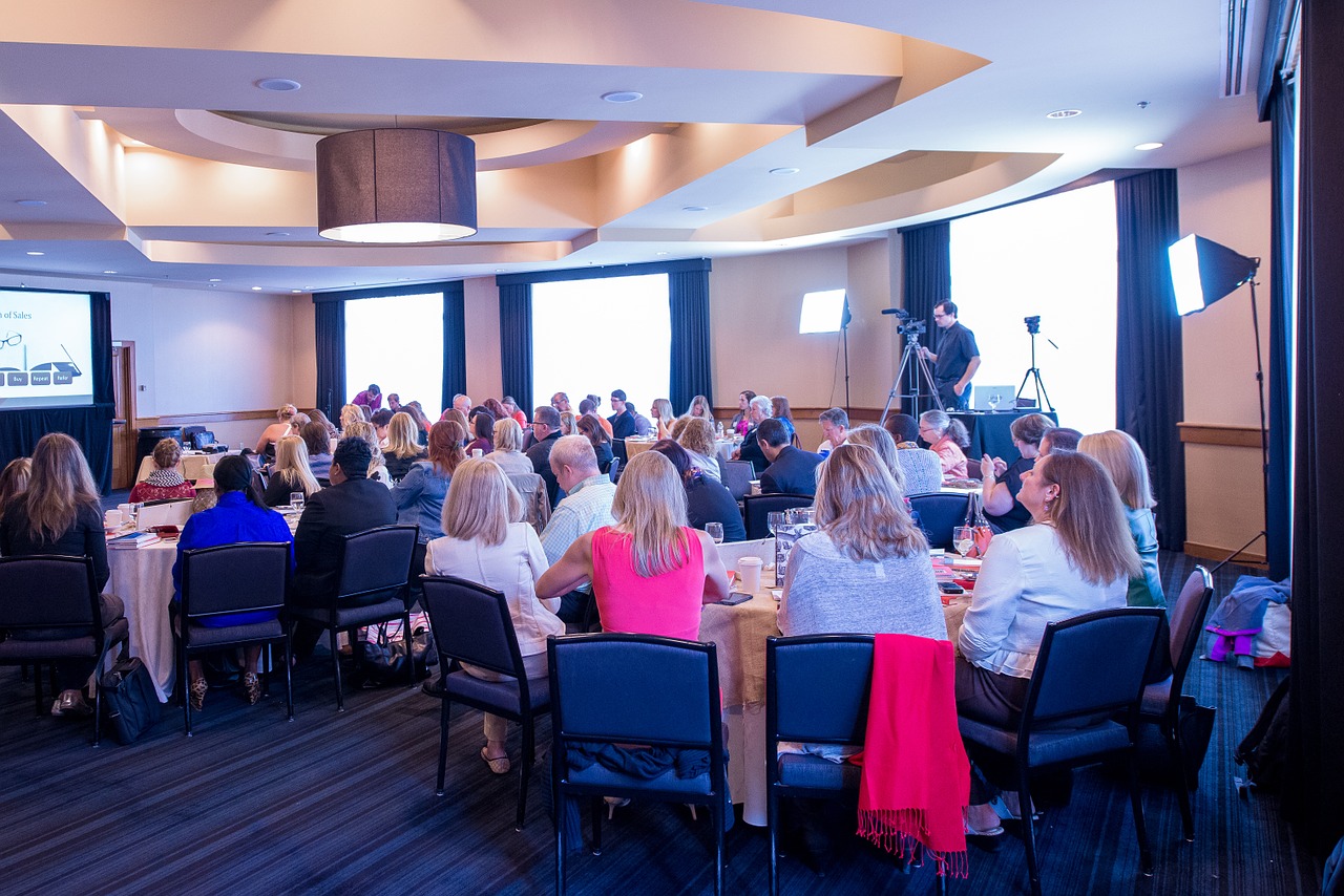 Room full of  professionals meeting