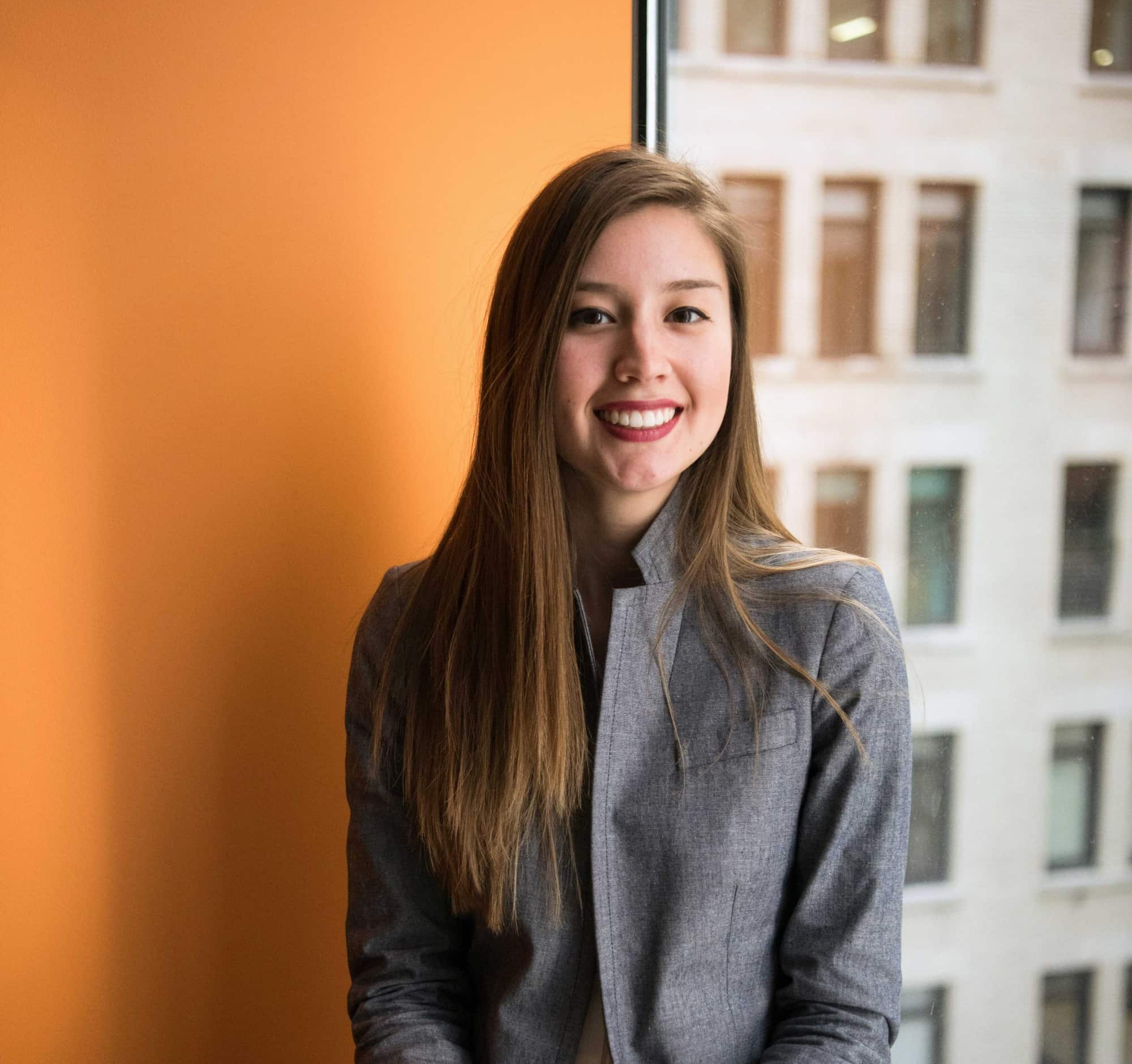 Smiling professional woman near window